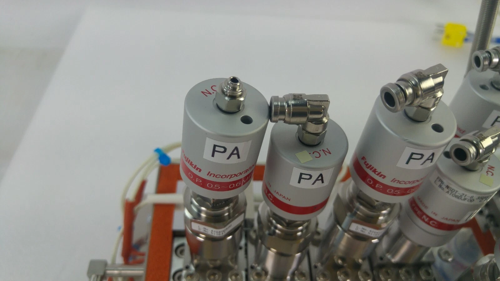 Fujikin Incorporated valve actuators labelled PA, TYPE N.C., O.P. 0.5~0.6 MPa