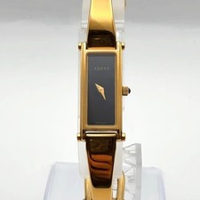 Ladies Gucci Gold Tone Black Dial 1500 Bangle Watch for sale