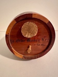 TWO UNIQUE VINTAGE ITEMS-A WOODEN COIN BANK AND A STATE CAPITALS COOKIE TIN