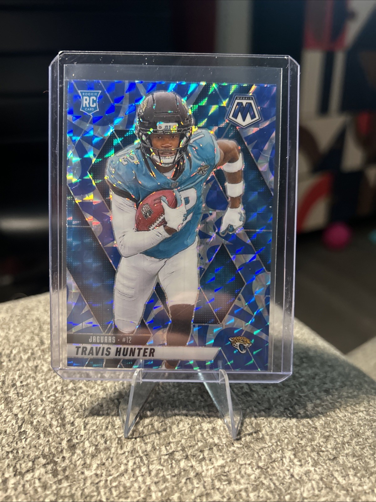 2025 Panini Mosaic - Rookies Travis Hunter #301 Reactive Blue Mosaic Prizm (RC)