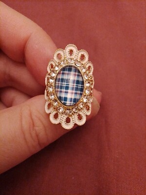 Loops Of White Enamel Around Crystal Halo print Of Tartan oval disc
