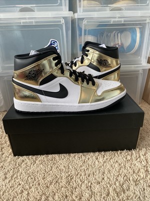 gold and black nike jordans