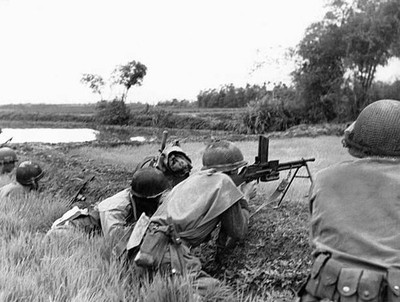 French soldiers respond to enemy fire edge of a village January 19- Old Photo