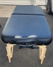 Used black Earthlite Spirit massage table with headrest