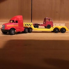 Tootsietoy Machinery Hauler hauling a Cab Over Semi Truck Cab