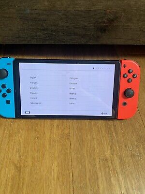 Nintendo Switch – OLED Model w/ Neon Red & Neon Blue Joy-Con