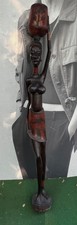 hand-carved African wooden sculpture village women water carier These statue re