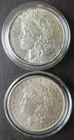 Two 1889 $1 Morgan Silver Dollars in Capsules