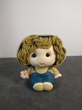 Vintage Little Girl with Hat Piggy Bank holding a flower
