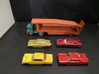 Y64-MATCHBOX LESNEY GUY WARRIOR CAR TRANSPORTER WITH FOUR MODEL CARS