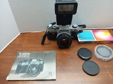 Canon AE1 35mm film camera with Canon FD 50mm 1.8 lens includes extras
