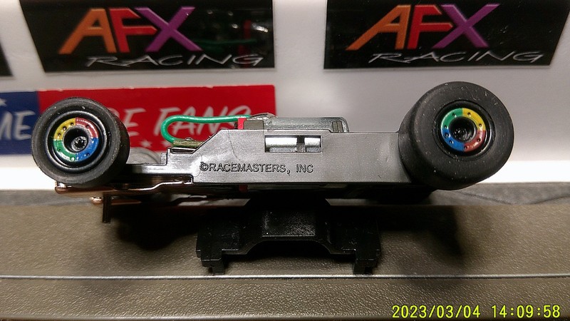 AFX RACING H.O. SCALE MEGA G+ 1.7 NARROW CHASSIS RAINBOW COLORED RIMS