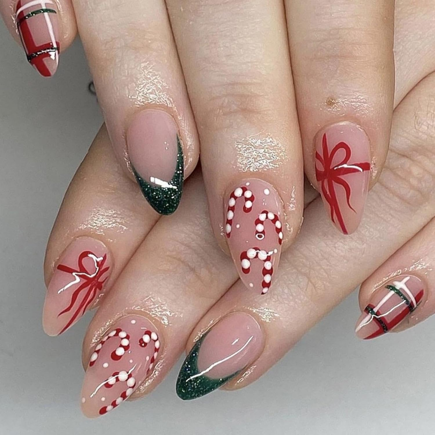 Festive Almond Press-On Nails with Holiday Gift Design