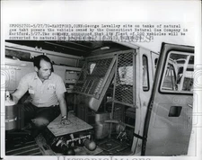 1970 Press Photo George Lavalley sits on tanks of natural gas