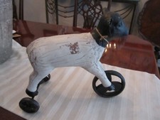 PRIMITIVE TOY WOOD COW ON 3 METAL WHEELS MARKED 2A13 - 10 1/2" LONG 9 1/2" TALL