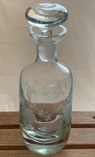 Toscany  hand blown glass Decanter with stopper. Has grapevine etched. 12" tall.