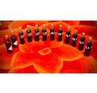 12 vintage Coca-Cola glass bottles (8oz each). All bottles are sealed and full. — photo 3