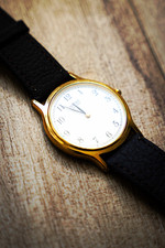 Seiko Quartz Round White Dial Arabic Numerals Gold Tone Strap 34 m