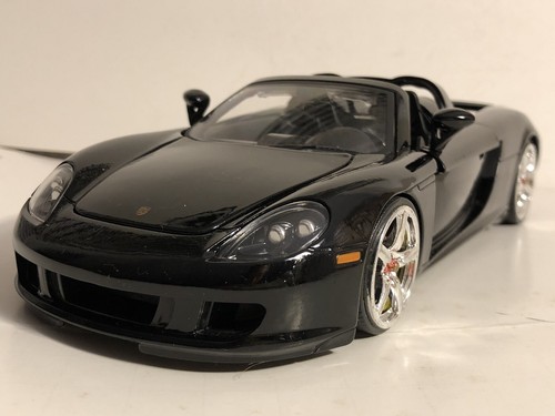 JADA DUB CITY 2005 PORSCHE CARRERA GT BLACK 1:24 DIECAST MODEL CAR NEW NO BOX - Afbeelding 1 van 10