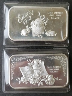 Two 1973 1oz Silver Holiday Bars in Plastic Envelopes