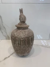 peters pottery mississippi retired urn with bunny lid. Nutmeg with Jade in rows.