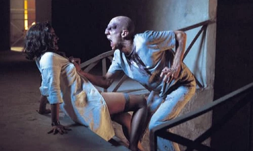 BEYOND RE-ANIMATOR DVD cover showing a man in white clothing struggling with a woman in similar white dress.