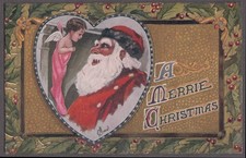 Santa Claus Christmas postcard Smiles at cherub angel in stocking by Ryan c 1910