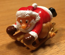 Jajko niespodzianka - figurka Świętego Mikołaja na saniach