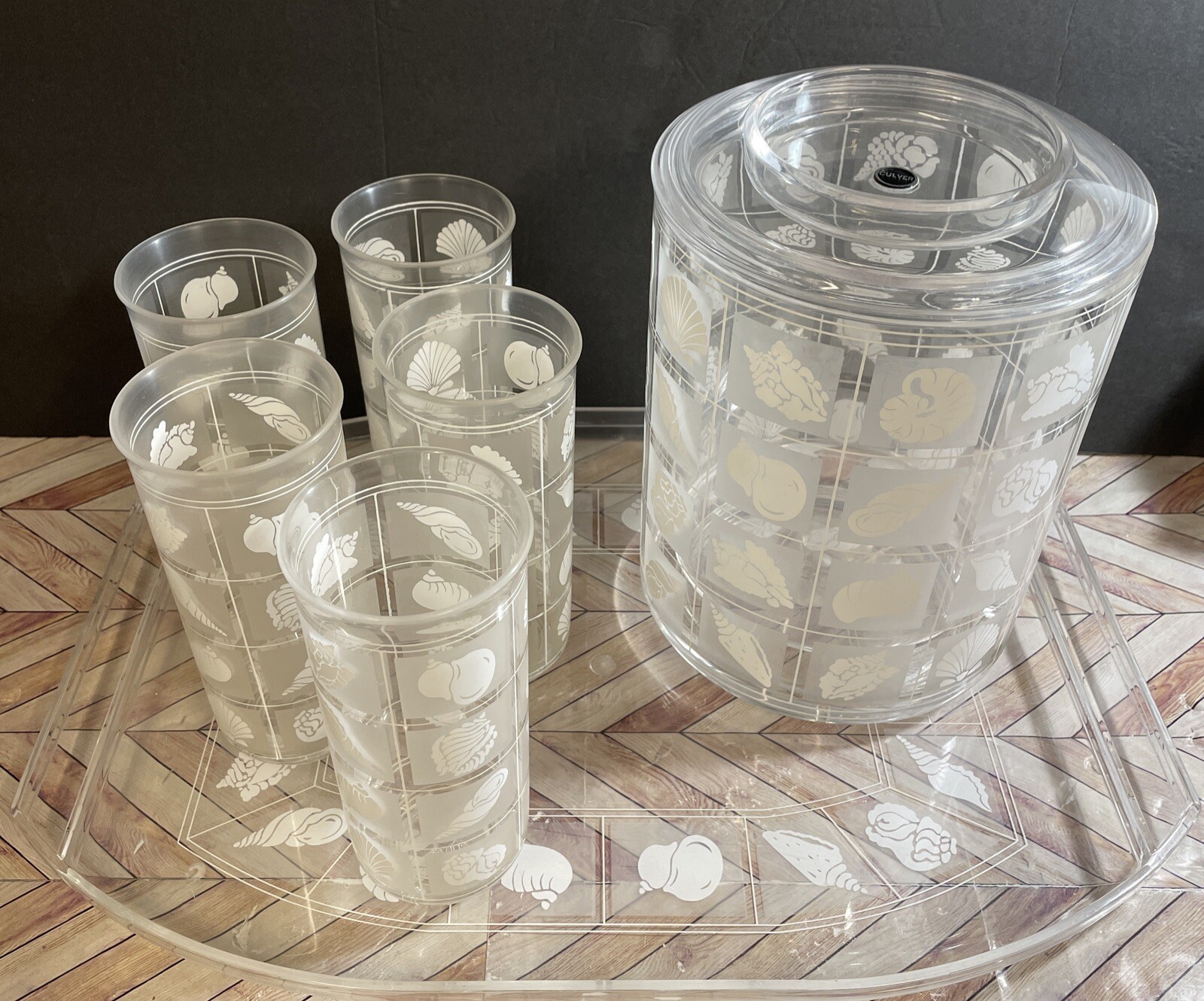Gold-flecked acrylic bar cart set with tray, ice bucket, and glasses