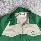 Green and tan VTG Pioneer Seeds Swingster jacket with front zipper, kangaroo pocket, and small white logo on left chest.
