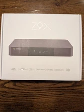 Z9X Media Player Grey includes: remote, SATA cable and wall cable.