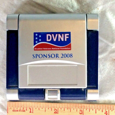PRESS BUTTON SELF STANDING CALCULATOR/CLOCK. NOT TESTED