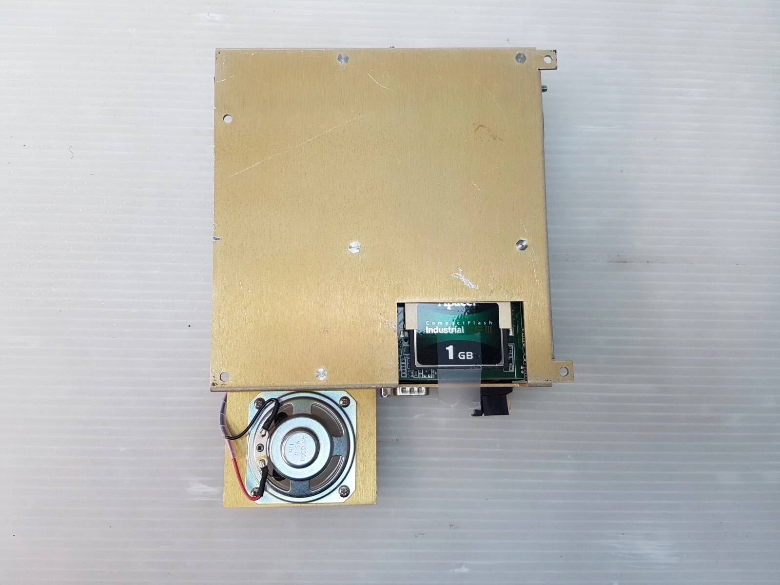 Underside of the GUIPC with speaker and 1 GB industrial CompactFlash card