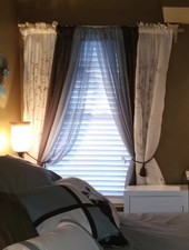Beige floral and vine design two panel curtain set