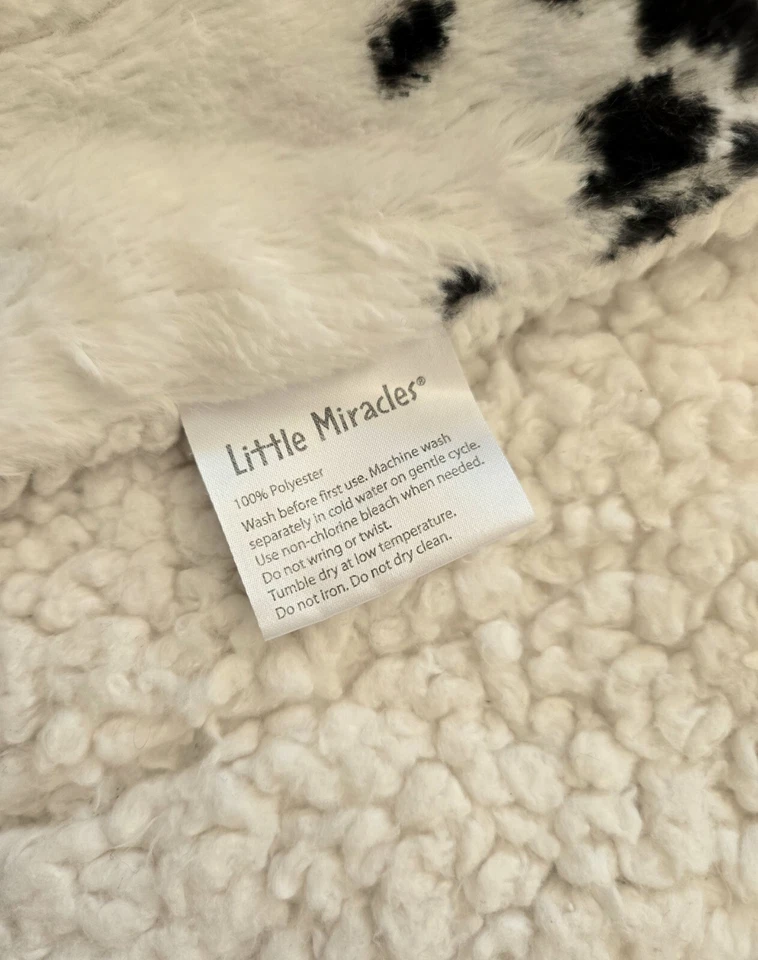 Manta de bebé Little Miracles patrón de vaca Sherpa felpa negra blanca 30x44 Costco Foto 3 de 4
