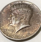 1965 Kennedy 40% Silver Half Dollar Maroon-Gold Toning Slight Wood Grain Look
