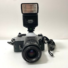 Nikon FG 35mm SLR Film Camera w/ Nikkor 35-70mm lens Sunpak Flash -- sold as is