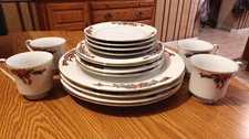 Tienshan Poinsettia Ribbon Fine China 16 piece Christmas Dinnerware Serv. for 4 