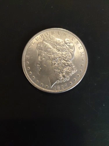 1897 AU MORGAN SILVER DOLLAR