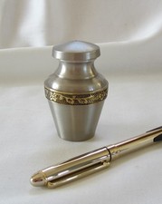 2955 solid brass keepsake cremation urn with pewter satin finish and floral trim