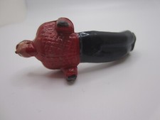 Vintage Lead Unbranded Male in Red and Black Laying Down