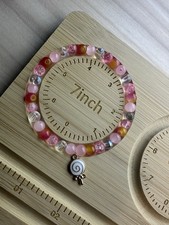 Beaded Bracelet with Pink, Multicolor Dangle Spiral Charm , 7 Inch
