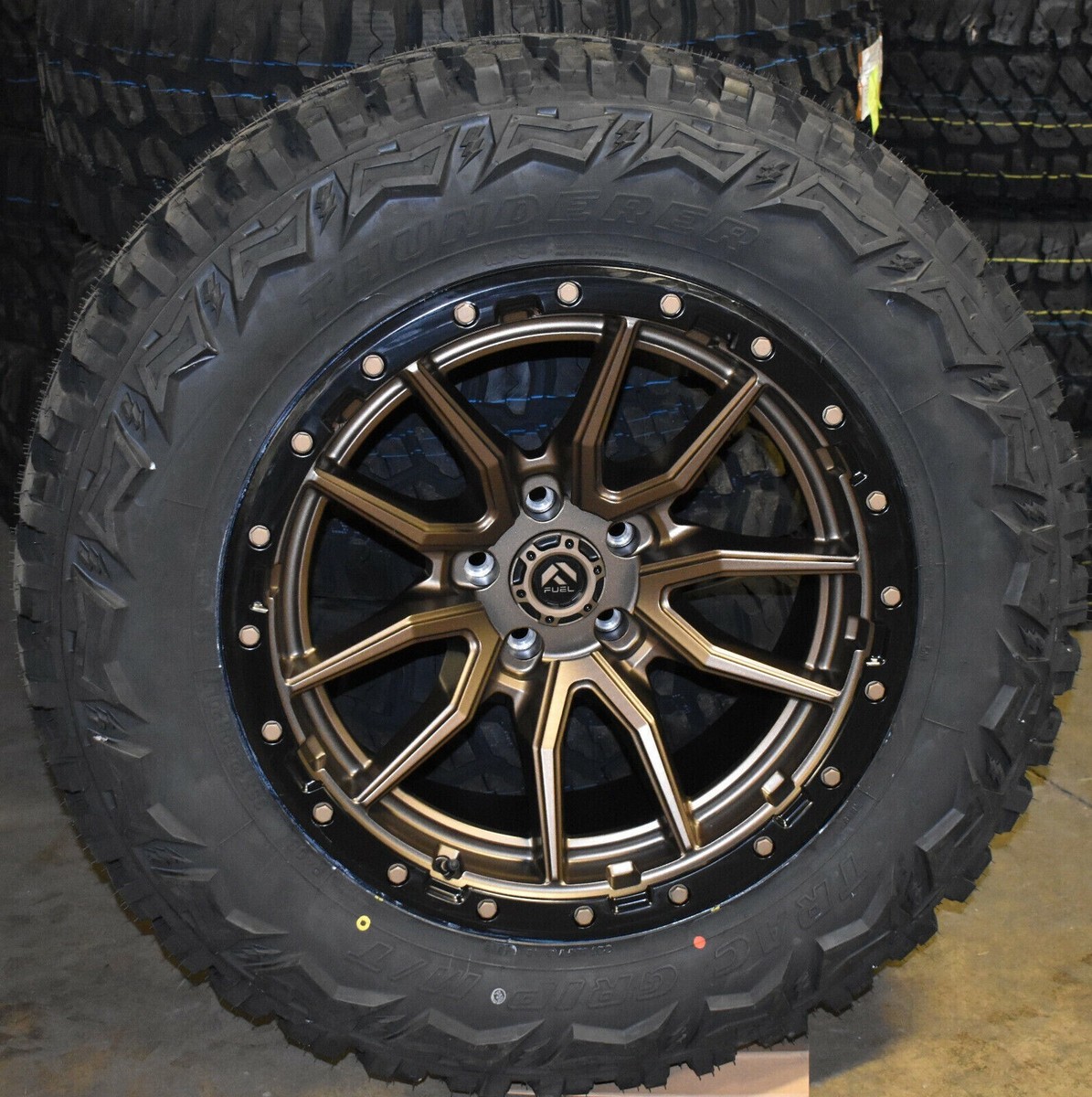 4) 20x10 Fuel D681 Rebel Bronze Wheels 35 MT Tires 6x5.5 Chevy