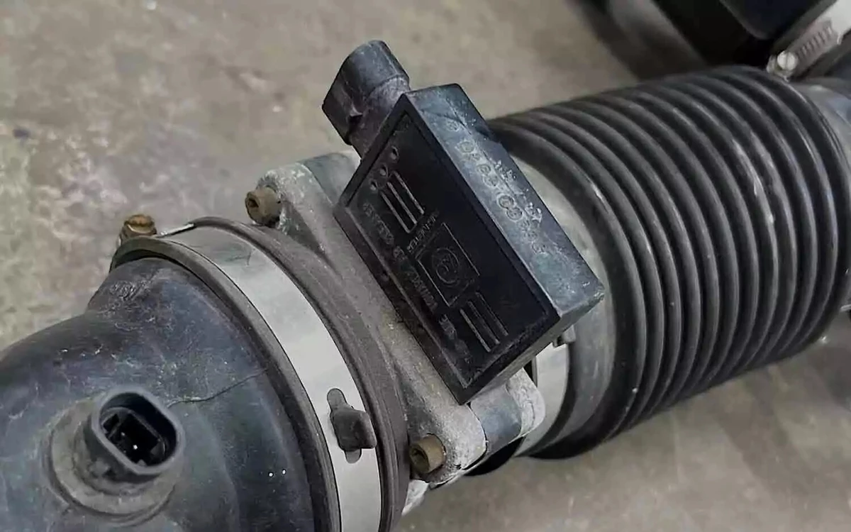 A 1996-1998 Chevrolet truck intake with an OEM mass air flow sensor.