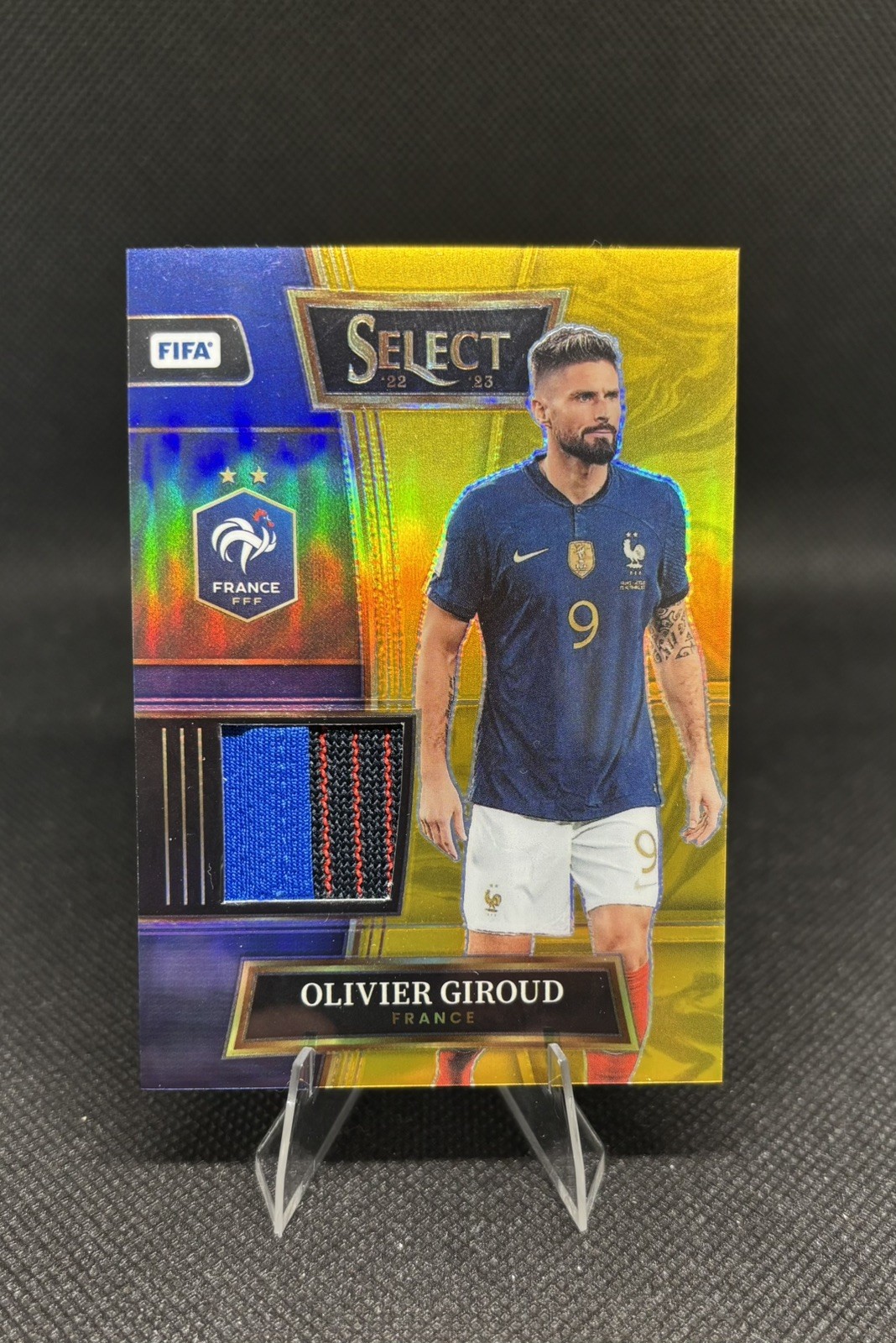2022-23 Panini Select FIFA Olivier Giroud Select Swatches Gold Prizm /10 #SW-OGD view 1