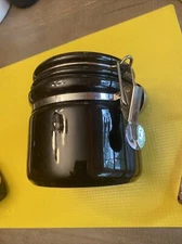 black canister OGGI Ceramic With Stainless Steel Spoon @ 5 1/4” High See Pics
