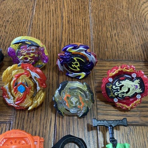 Hasbro Beyblade Burst lot of 9 Spinners and Launchers with Ripcords Plastic 2017 - Picture 4 of 12