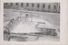 WW2 Photo of Army Truck Beside Courtyard With Training Poles