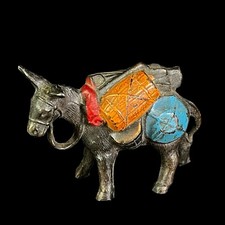 Burro burro vintage de metal fundido con paquete silla de montar figura pintada