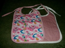 2 LARGE QUILTED BABY BIBS - 1 alice in wonderland - 1 pink with ties